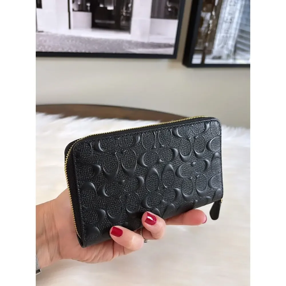 Coach Black Embossed Signature Leather Zip Wallet with Gold Hardware